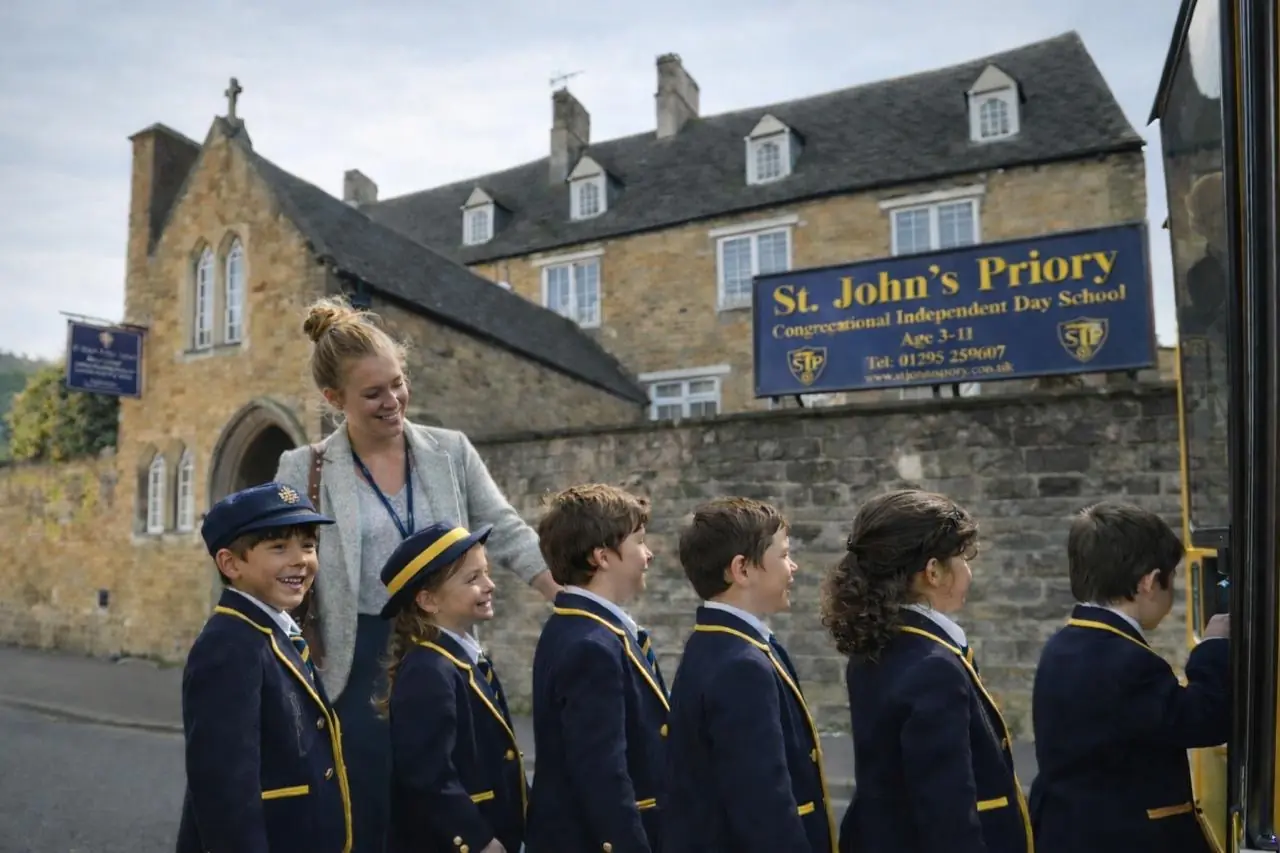 Pupils boarding the school bus outside St John's Priory