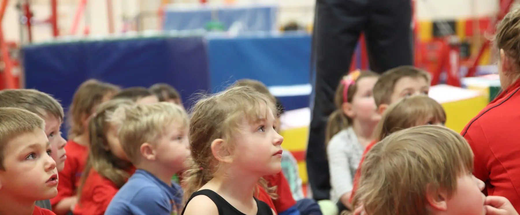 A group of young children listening together